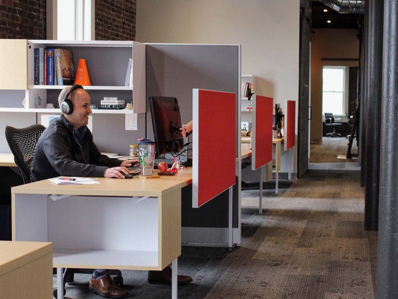 Curran office cubicle with employee